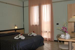 Postel nebo postele na pokoji v ubytování Hotel Gran Delta