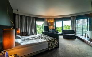 Postel nebo postele na pokoji v ubytování mOdus Hotel