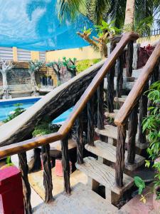 een houten trap naast een zwembad bij Srjo Fun Central Resort in Calamba