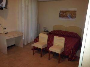 Cama o camas de una habitación en Hotel Meridiana