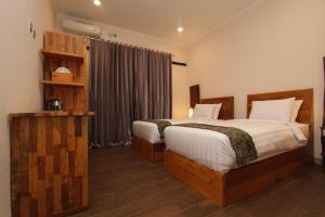 Cama ou camas em um quarto em Saka Boutique Hotel