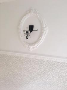 a white ceiling with a chandelier in a room at House in Lviv in Lviv