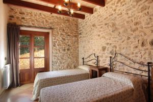 A bed or beds in a room at Petit