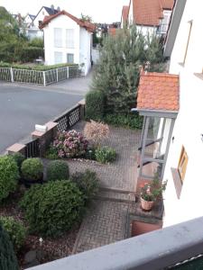 a view of a garden from the balcony of a house at Ferienwohnung im Rhein-Main Gebiet nahe Frankfurt, Rödermark in Rödermark