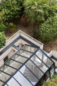an overhead view of a building with glass windows at Hotel Bootcamp in Issy-les-Moulineaux