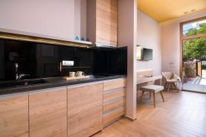 a kitchen with a sink and a counter top at On The Rocks in Theológos