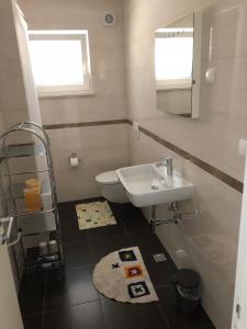 Kylpyhuone majoituspaikassa Apartmani Nada