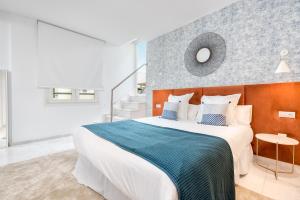 Posteľ alebo postele v izbe v ubytovaní iloftmalaga Deluxe Alameda Principal + 37 fotografií