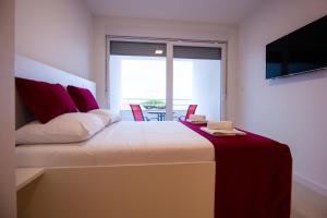 Postel nebo postele na pokoji v ubytování Residences Bellavista 3
