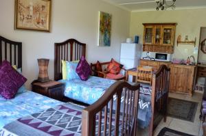 Säng eller sängar i ett rum på Petra's Country Guesthouse