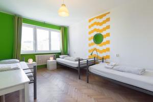 מיטה או מיטות בחדר ב-Patio Hostel