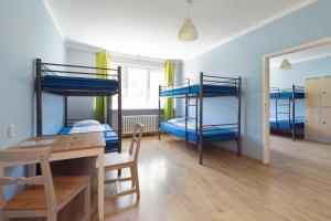 מיטה או מיטות בחדר ב-Patio Hostel