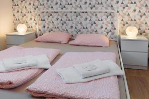 מיטה או מיטות בחדר ב-Patio Hostel