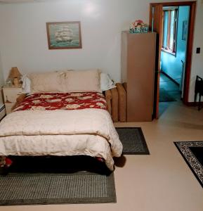 a bedroom with a bed and a dresser at Cricket Hill in Killington