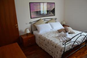 Кровать или кровати в номере Casa dei girasoli
