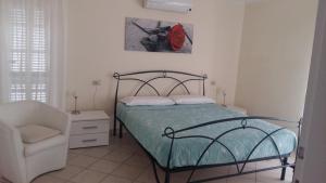 En eller flere senge i et værelse på Appartamento in villa