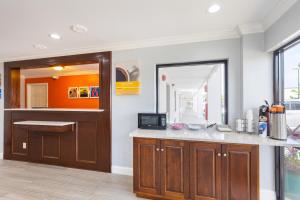 a kitchen with a counter and a mirror at Motel 6-Albany, GA in Albany