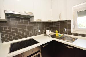 A cozinha ou cozinha compacta de Apartman Viktoria