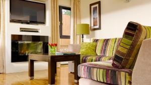 a living room with a couch and a table at Self Catering Holiday Homes Killarney Town Centre in Killarney