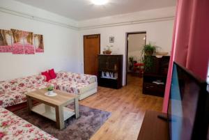 a living room with a couch and a table at Apartman Oaza in Trebinje