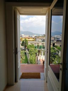 an open door to a balcony with a view at Casa Castellano in Nola