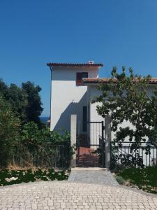 a house with a gate in front of it at Seliche in Cala Gonone
