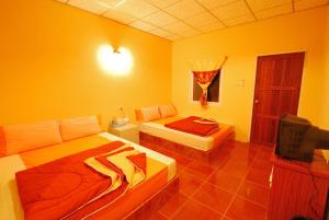 Postel nebo postele na pokoji v ubytování Ban Tonnam Resort