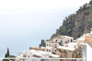 
a large building with a boat on top of it at Maristella in Positano
