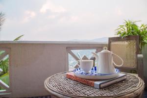 Příslušenství pro přípravu čaje a kávy v ubytování Holiday Stay Inn