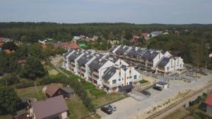 an overhead view of a residential neighborhood with houses at Bursztynowy Apartament in Jantar