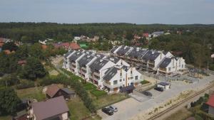 an overhead view of a residential neighborhood with houses at Bursztynowy Apartament in Jantar