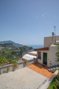 a house with a view of the ocean at DAME casa vacanza in Amalfi