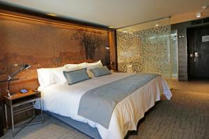Katil atau katil-katil dalam bilik di Hotel Cumbres Lastarria