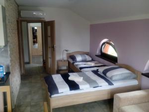 a bedroom with two beds in a room at Oaza in Vacenovice +55 photos