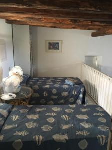 a bedroom with two beds and a stuffed animal at Villa in Panarea - Nespolo in Panarea