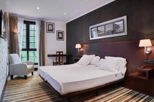 Ένα ή περισσότερα κρεβάτια σε δωμάτιο στο Hotel Granda