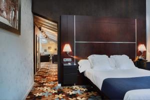 Postel nebo postele na pokoji v ubytování Hotel Granda