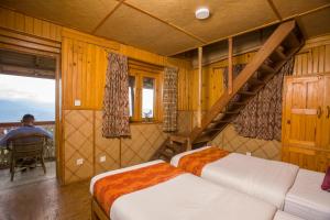 Tempat tidur dalam kamar di Everest Manla Resort