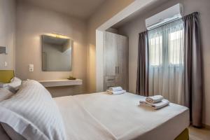 Postel nebo postele na pokoji v ubytování Asteri Apartments und Studios
