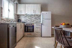 Kuchyň nebo kuchyňský kout v ubytování Asteri Apartments und Studios