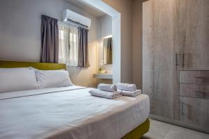 Postel nebo postele na pokoji v ubytování Asteri Apartments und Studios