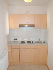 A kitchen or kitchenette at Appartementhaus Bergland