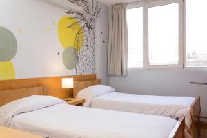 Postel nebo postele na pokoji v ubytování Circus Hostel