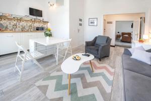 a living room with a couch and a table at Apartament Zamkowy in Lądek-Zdrój