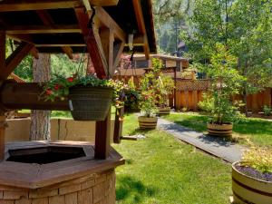 a garden with potted plants on a wooden pergola at Heavenly Valley Townhouses in South Lake Tahoe