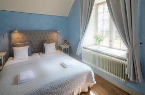 Postel nebo postele na pokoji v ubytování Kastellet Bed & Breakfast