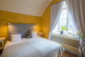 Postel nebo postele na pokoji v ubytování Kastellet Bed & Breakfast
