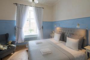Postel nebo postele na pokoji v ubytování Kastellet Bed & Breakfast