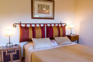 Postel nebo postele na pokoji v ubytování Agriturismo & Cantina Tenuta Casteani
