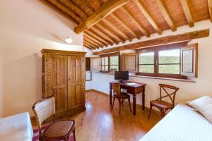Postel nebo postele na pokoji v ubytování Agriturismo & Cantina Tenuta Casteani